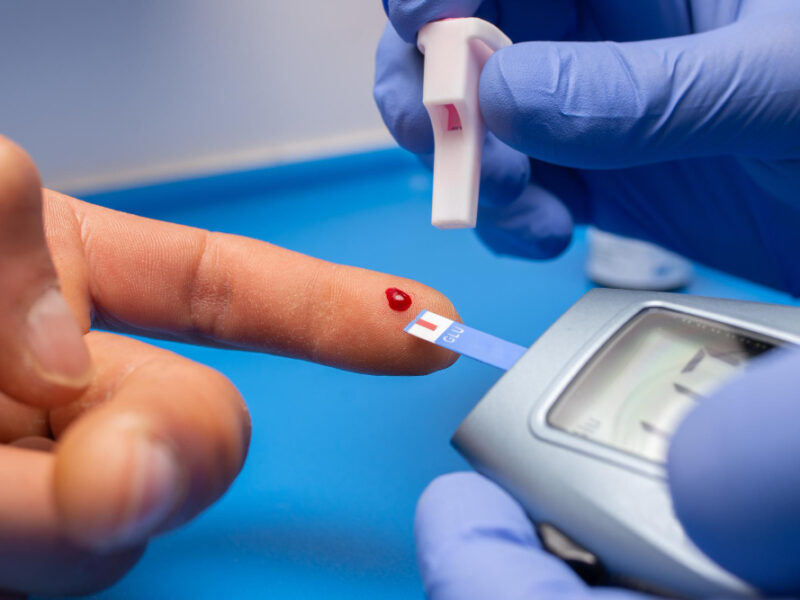 closeup-shot-doctor-with-rubber-gloves-taking-blood-test-from-patient